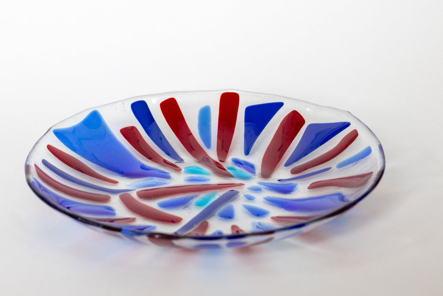 glass bowl with red and blue lines