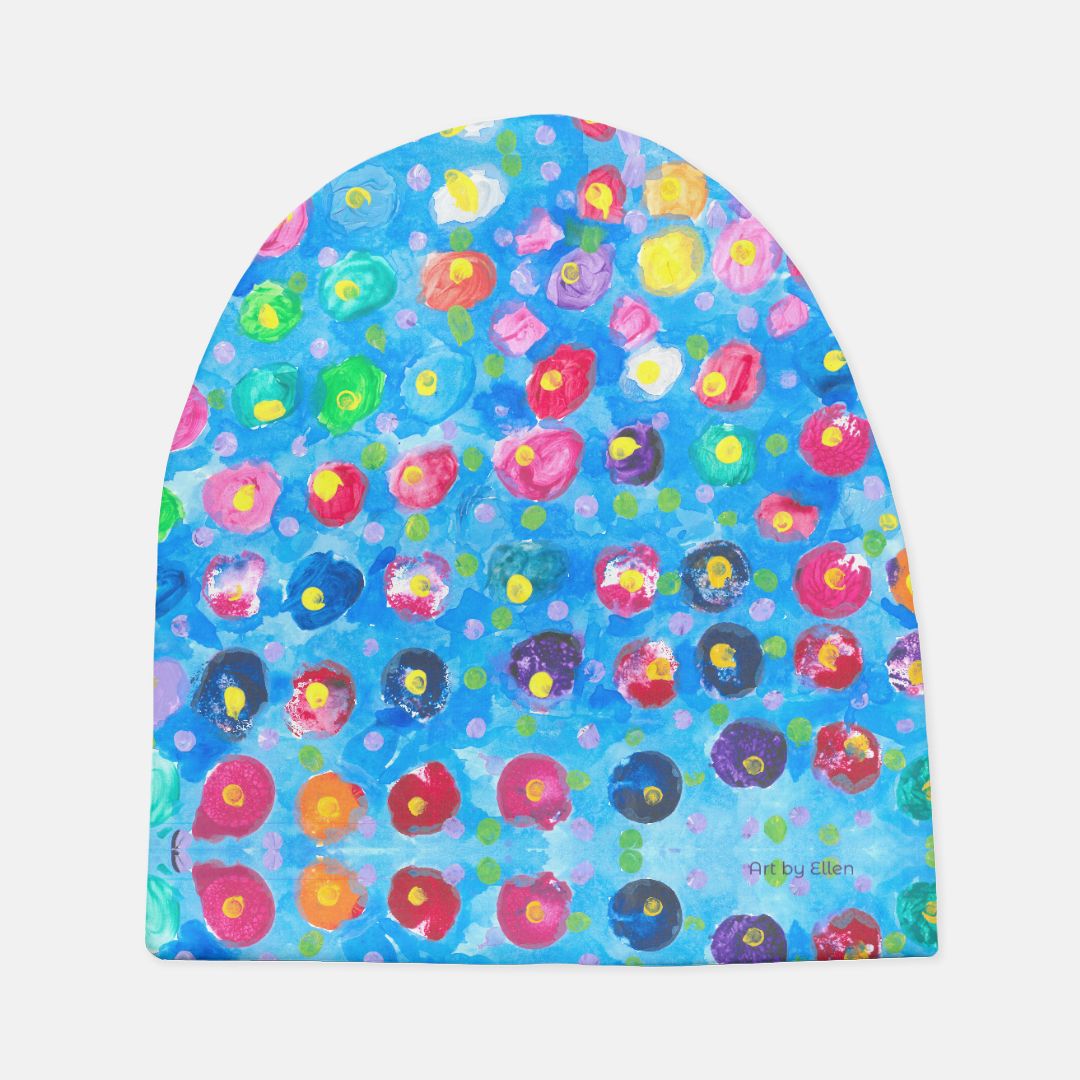 baby hat with design of blue with polkadots of many colors