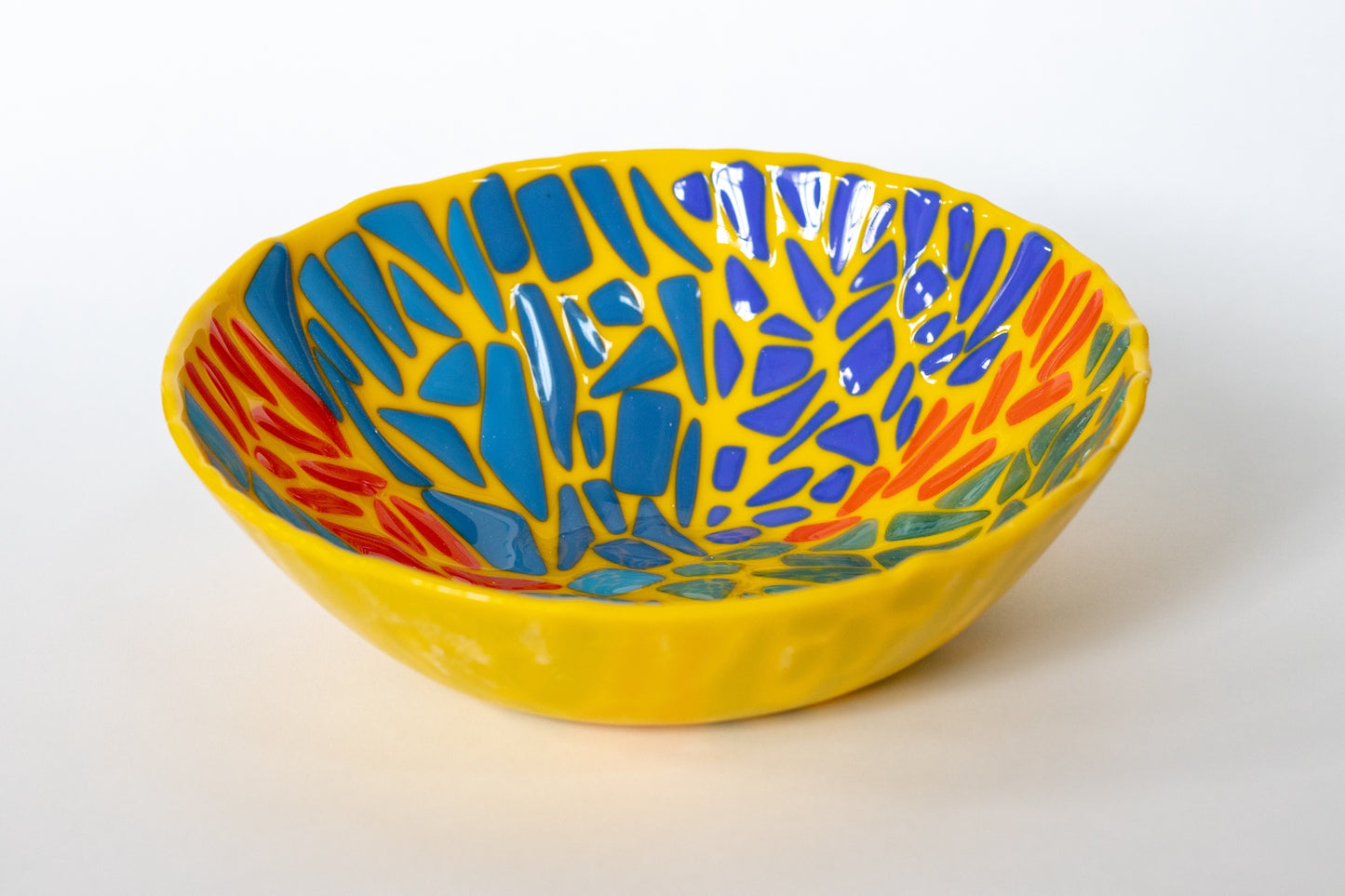 yellow bowl with blues and orange