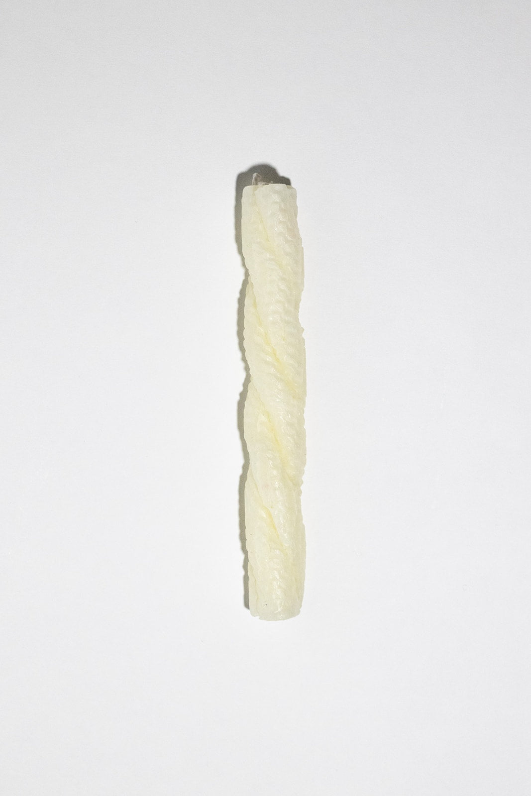 twisted candle of three strands of white