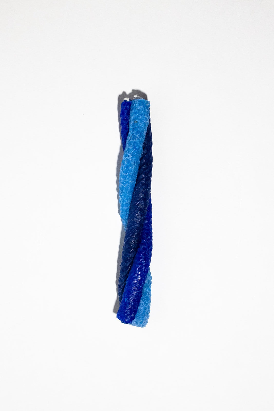 twisted candles of three shades of blue