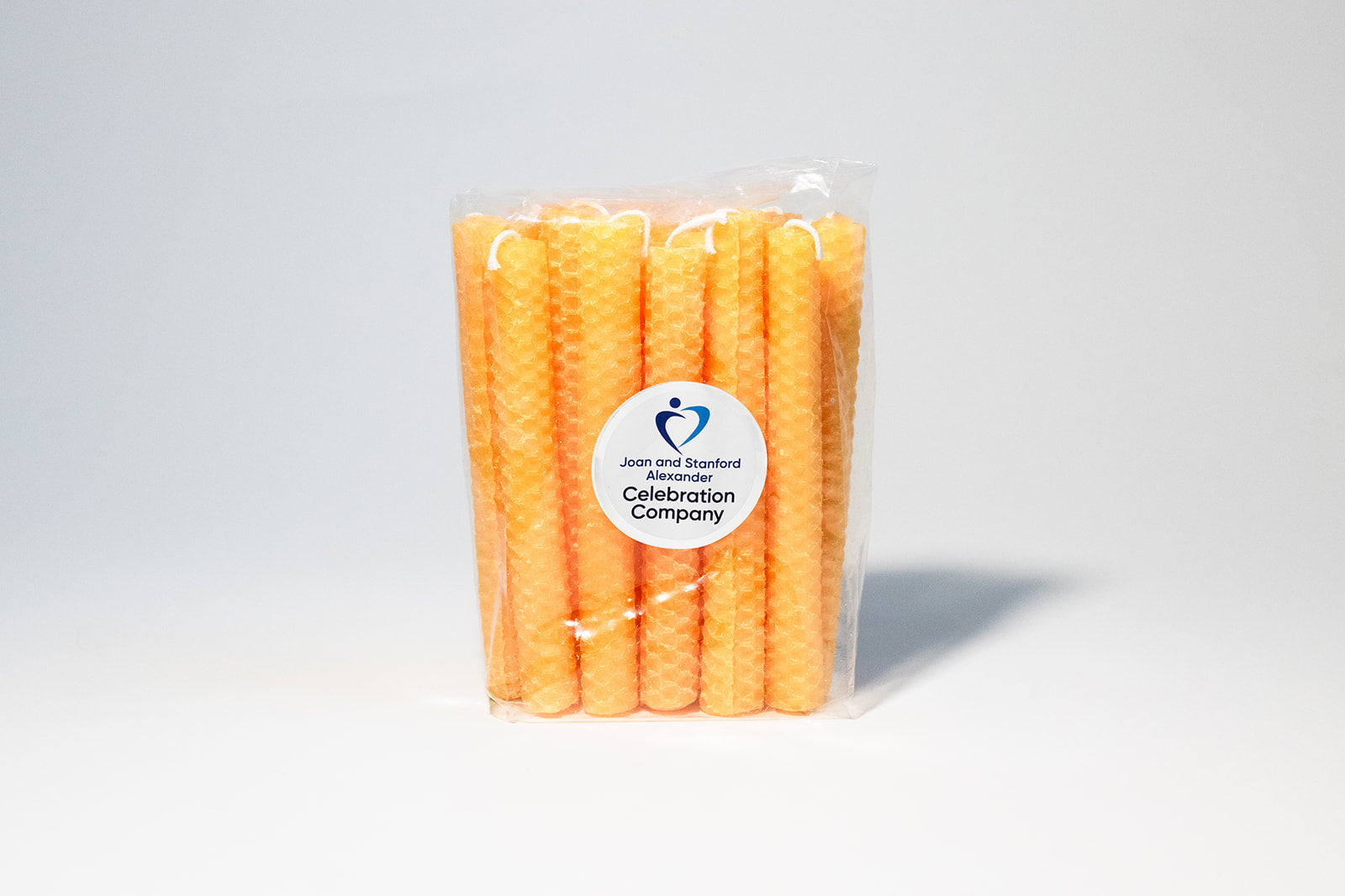Package of 16 orange Shabbat candles in clear package