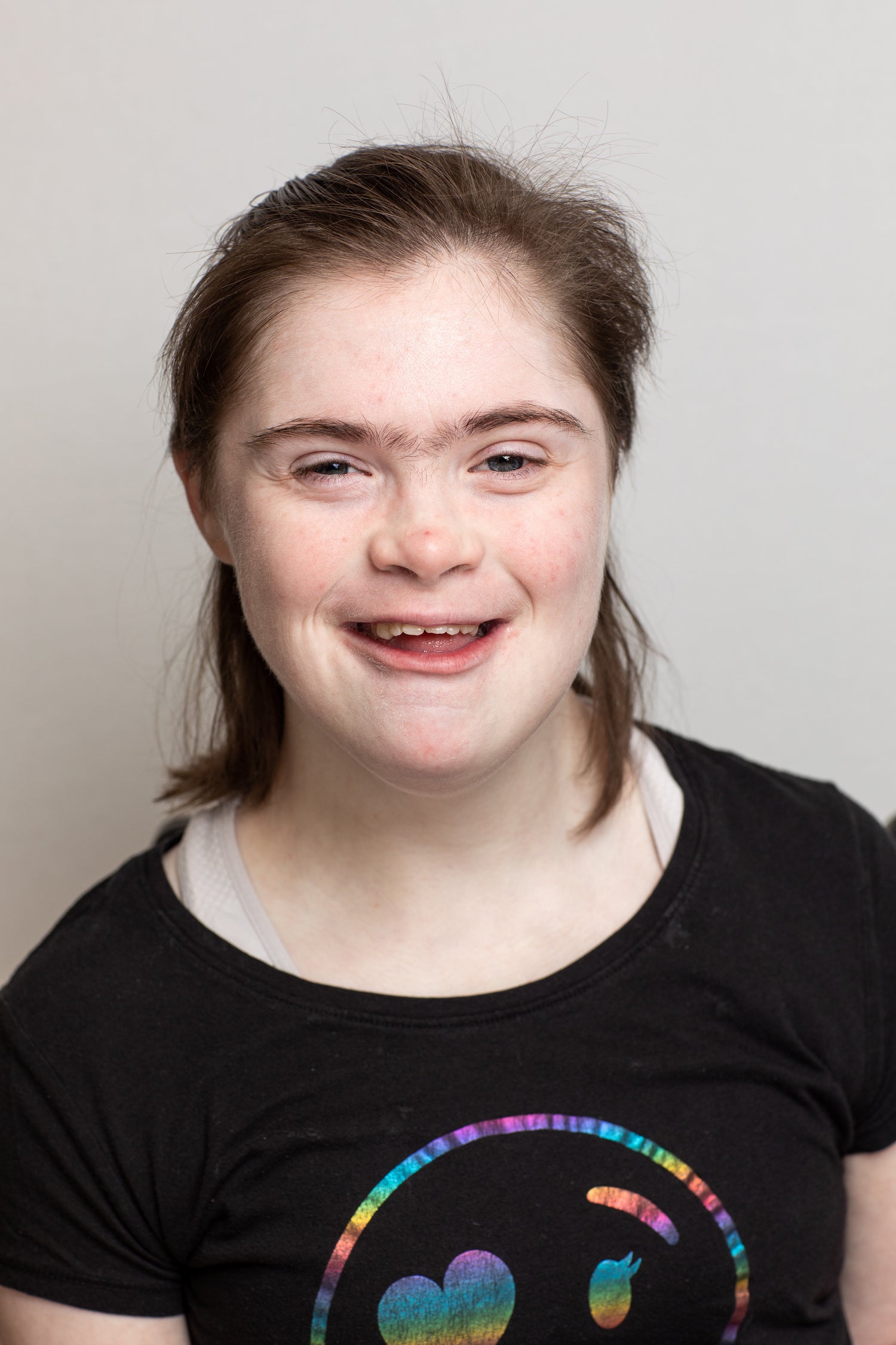 young woman with shoulder length hair smiling