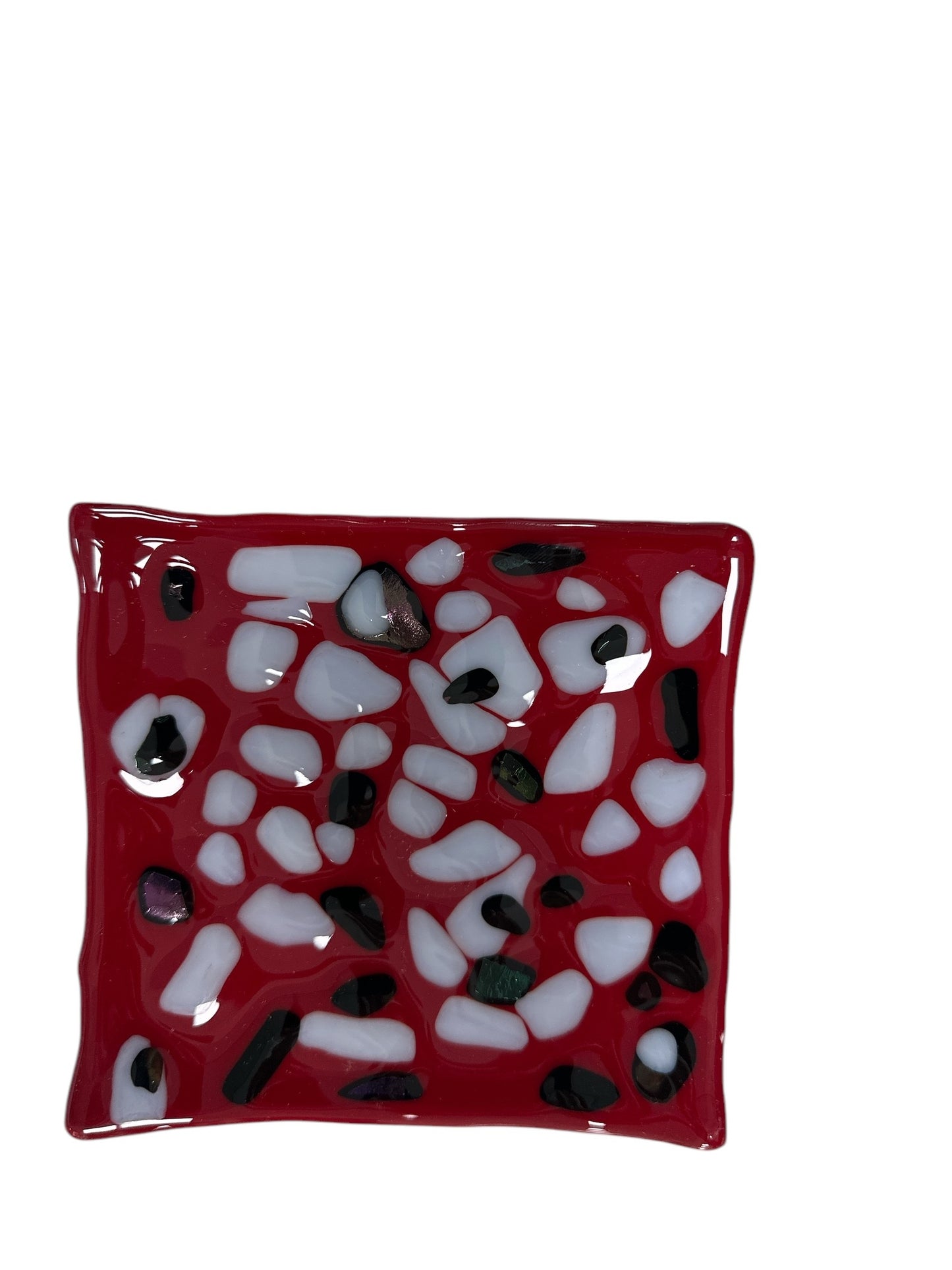 Red wavy tray with white and black dots.