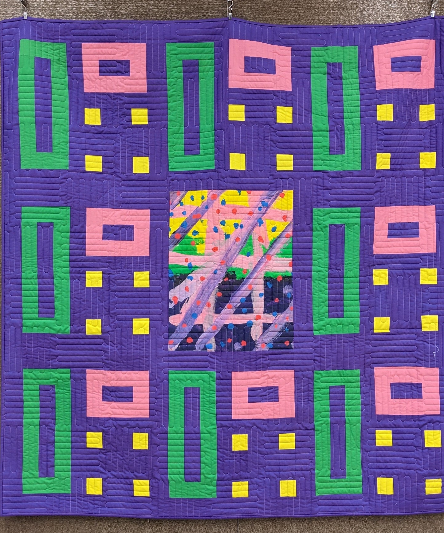 art quilt with purple, green, and yellow