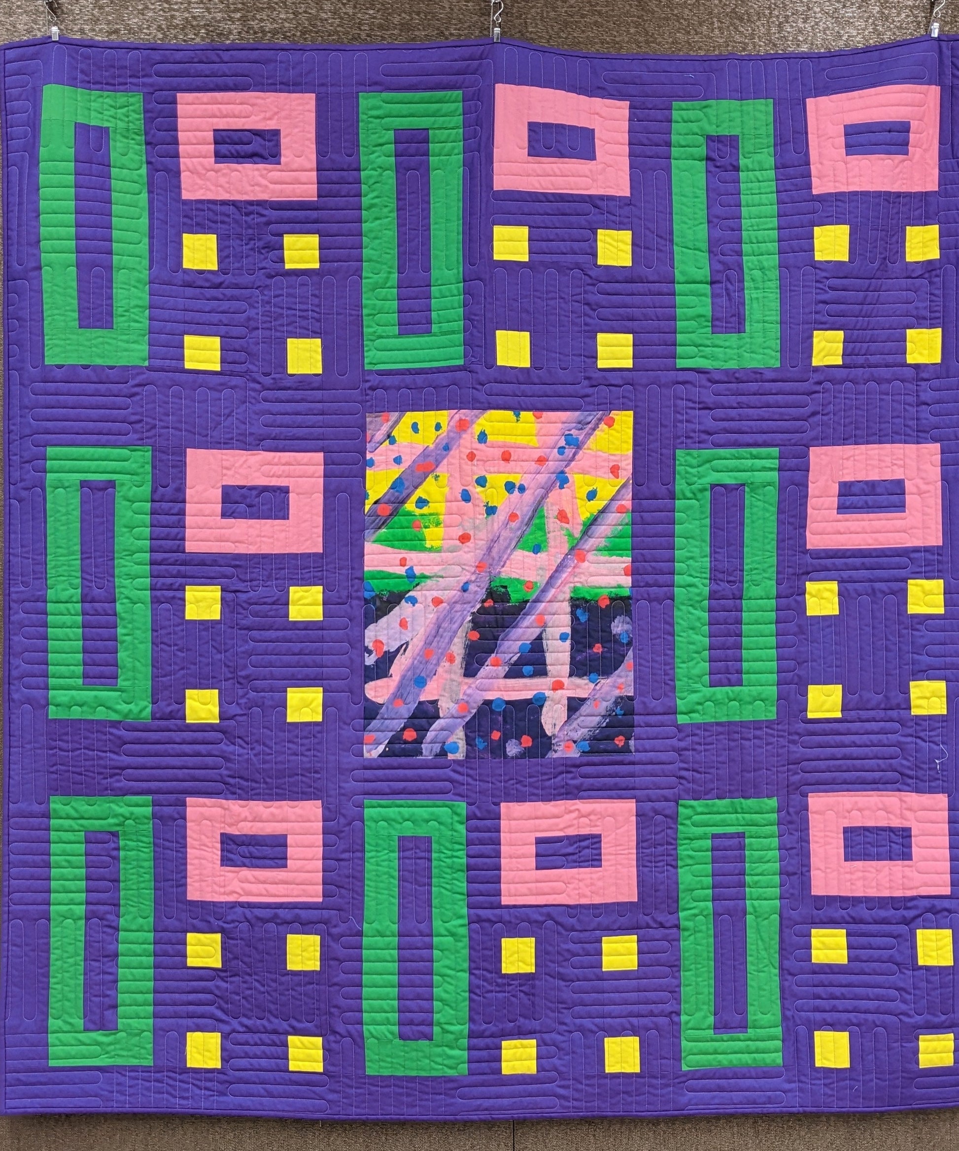 art quilt with purple, green, and yellow