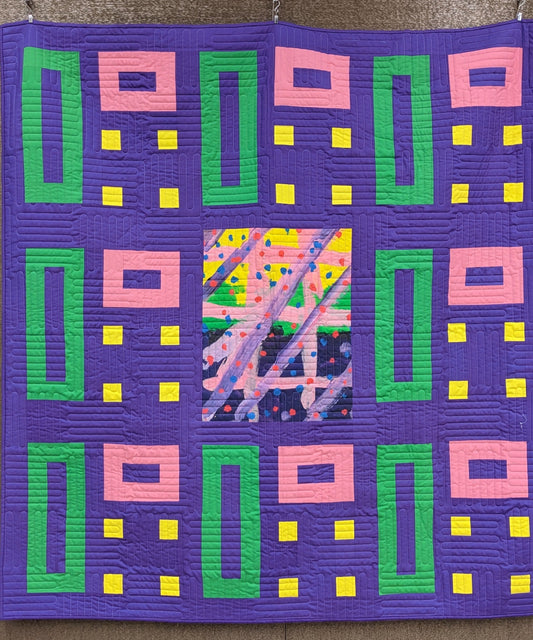 art quilt with purple, green, and yellow
