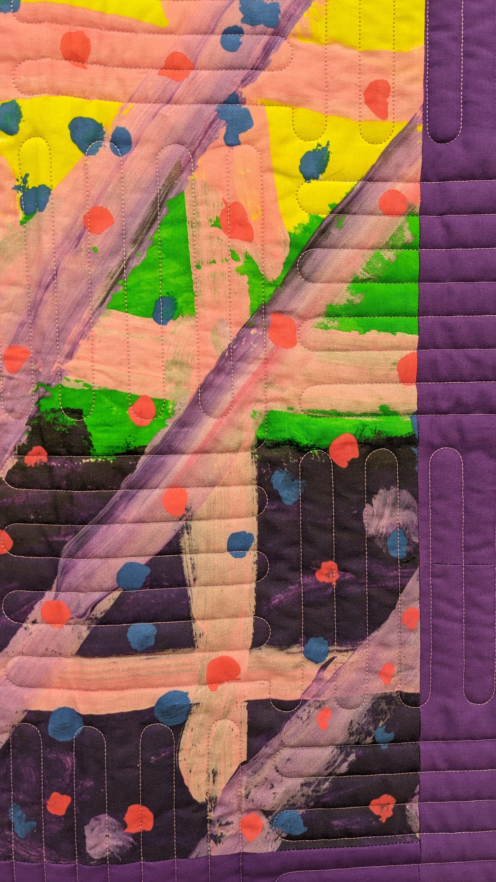 art quilt with purple, green, and yellow