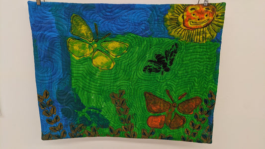 quilt of artwork with butterflies