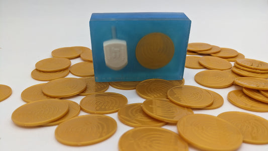 chanukah themed soap with dreidel and gelt embedded inside
