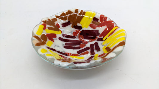 glass bowls with white, yellow, red, and brown lines