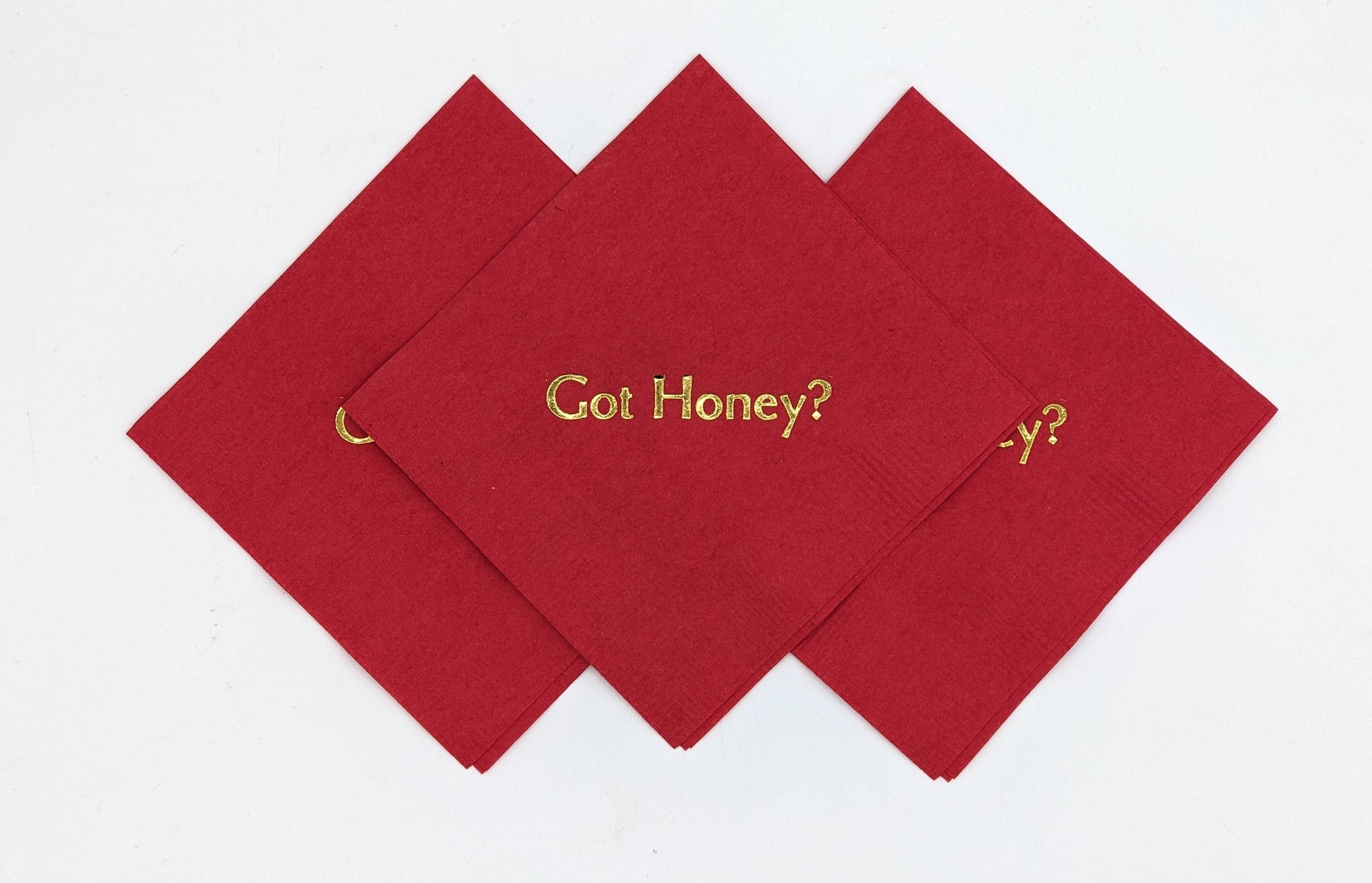 red cocktail napkins with got honey? on it