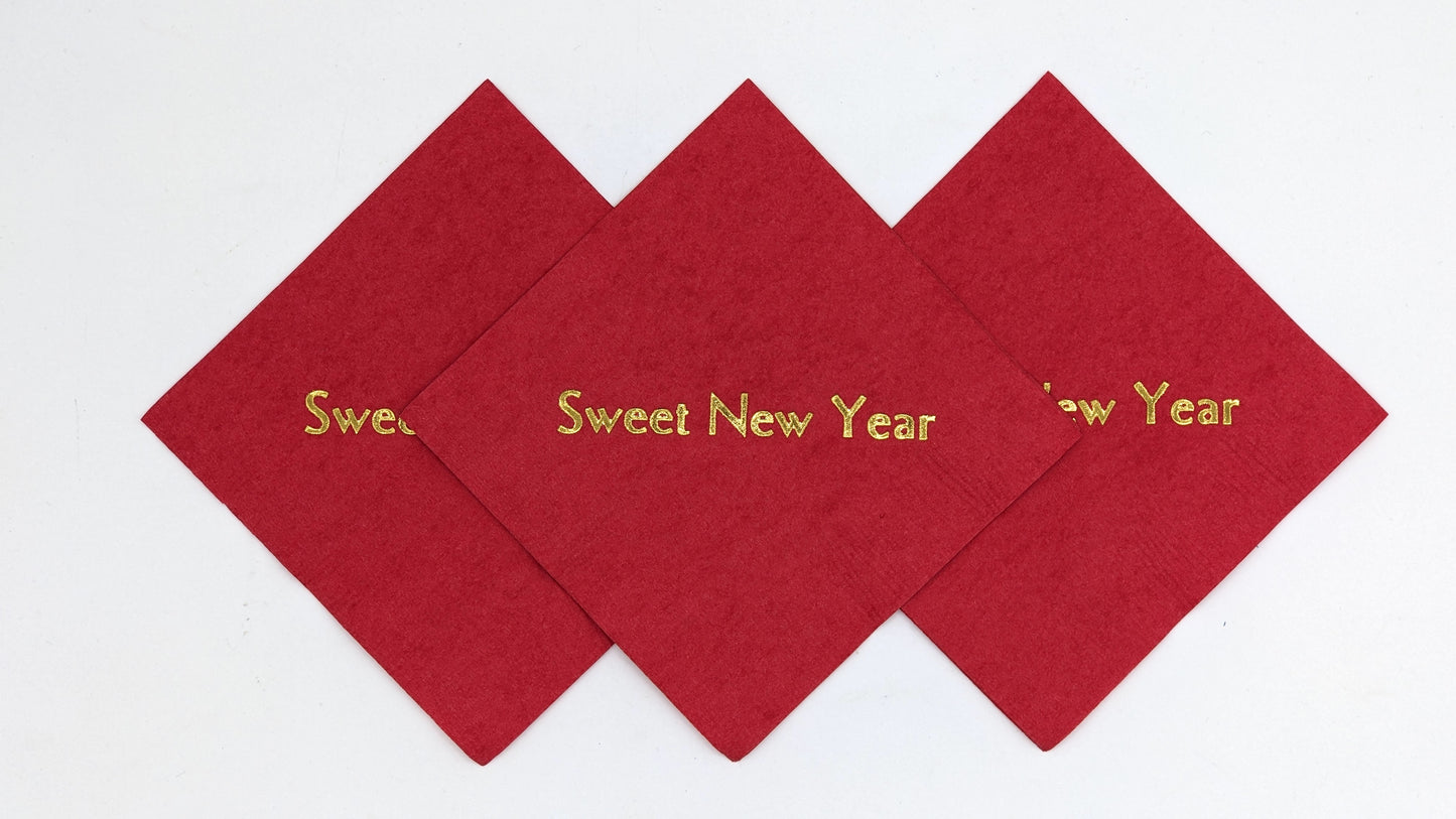 red cocktail napkins with sweet new year on it