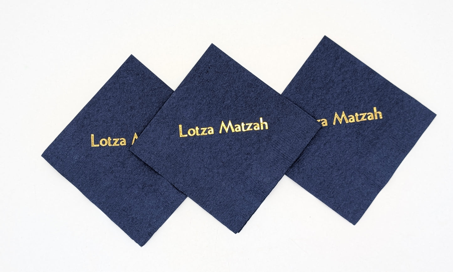 grouping of 3 navy napkins that say lots of matzah