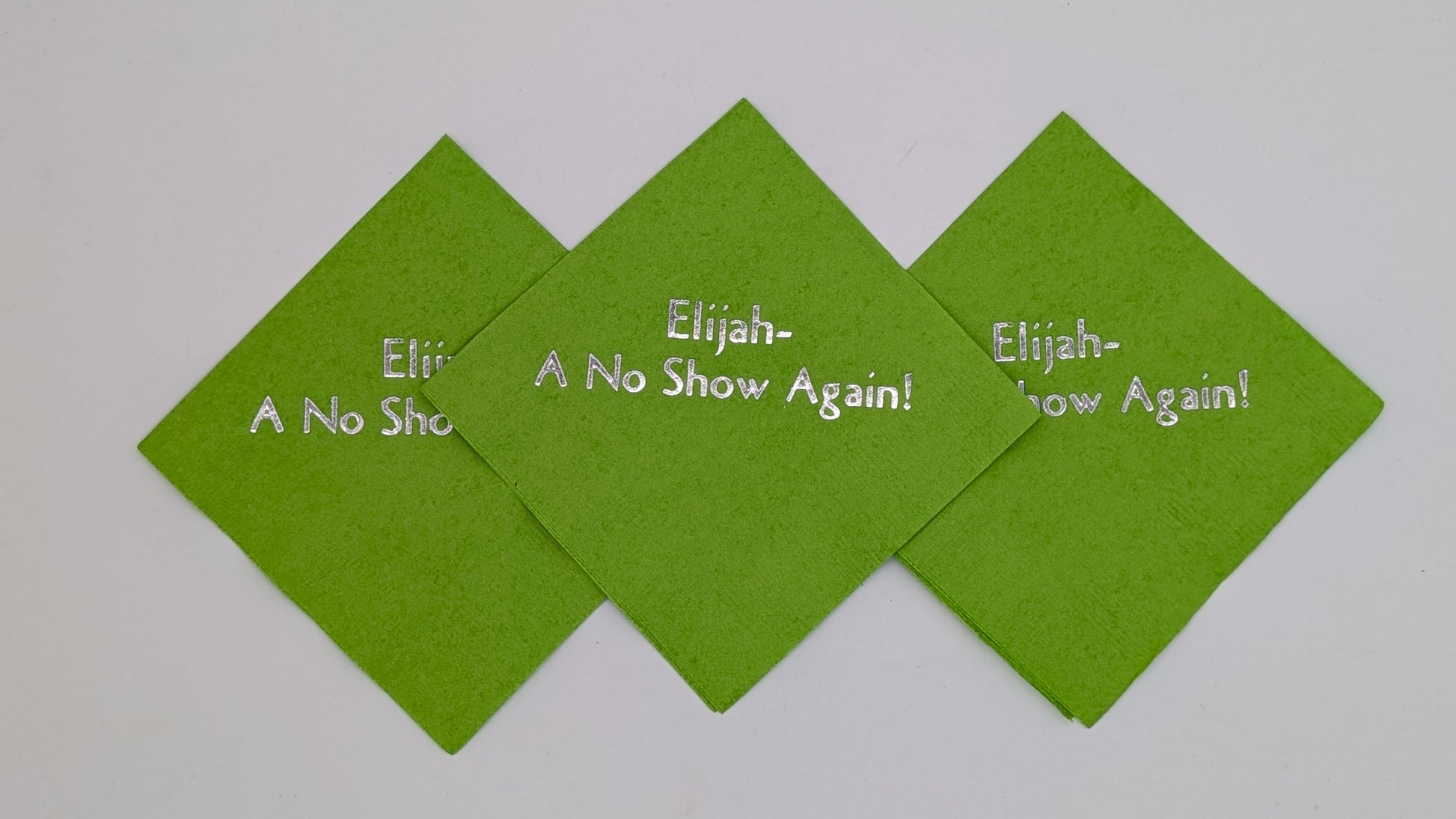 picture of 3 lime napkins with the saying Elijah a no show again