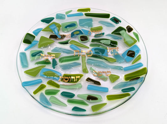 glass seder plate made with various shades of green and teal