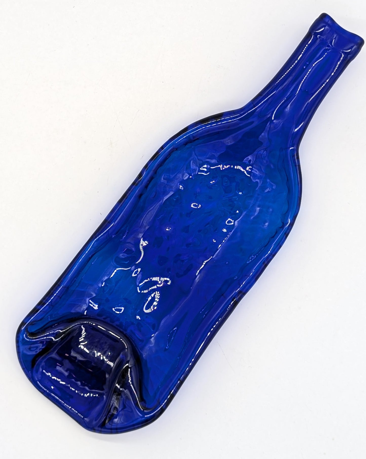 blue wine bottle formed into dish