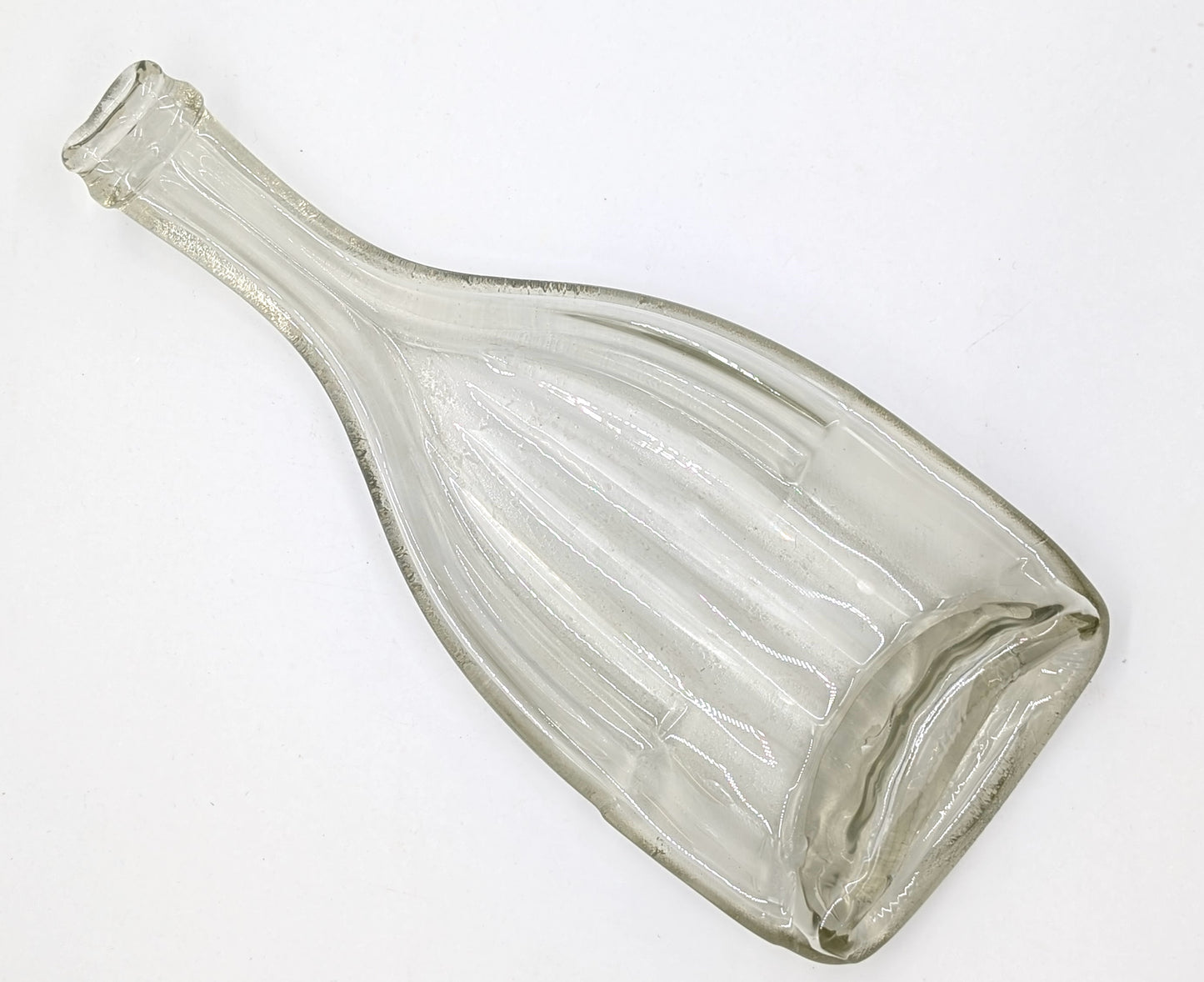 clear wine bottle formed into a dish
