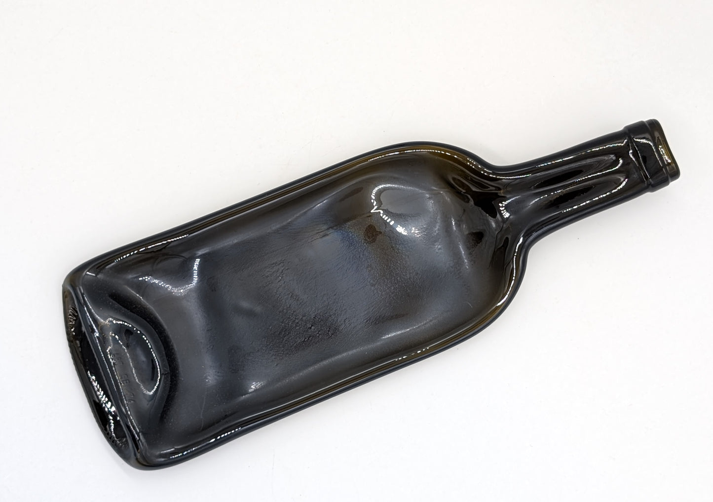 amber colored wine bottle formed into a dish