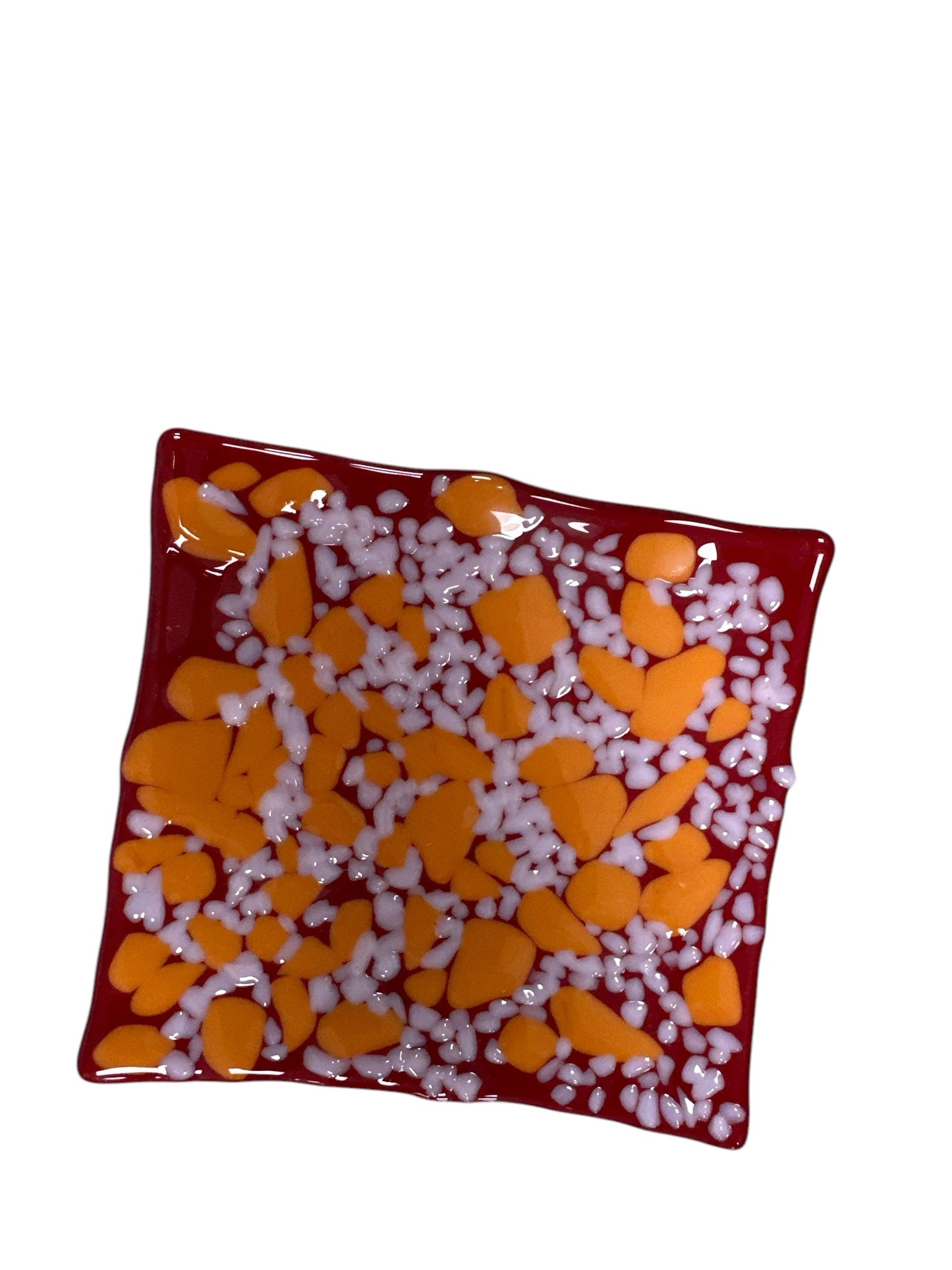 Red glass wavy plate with dots of orange and white; Green and blue.