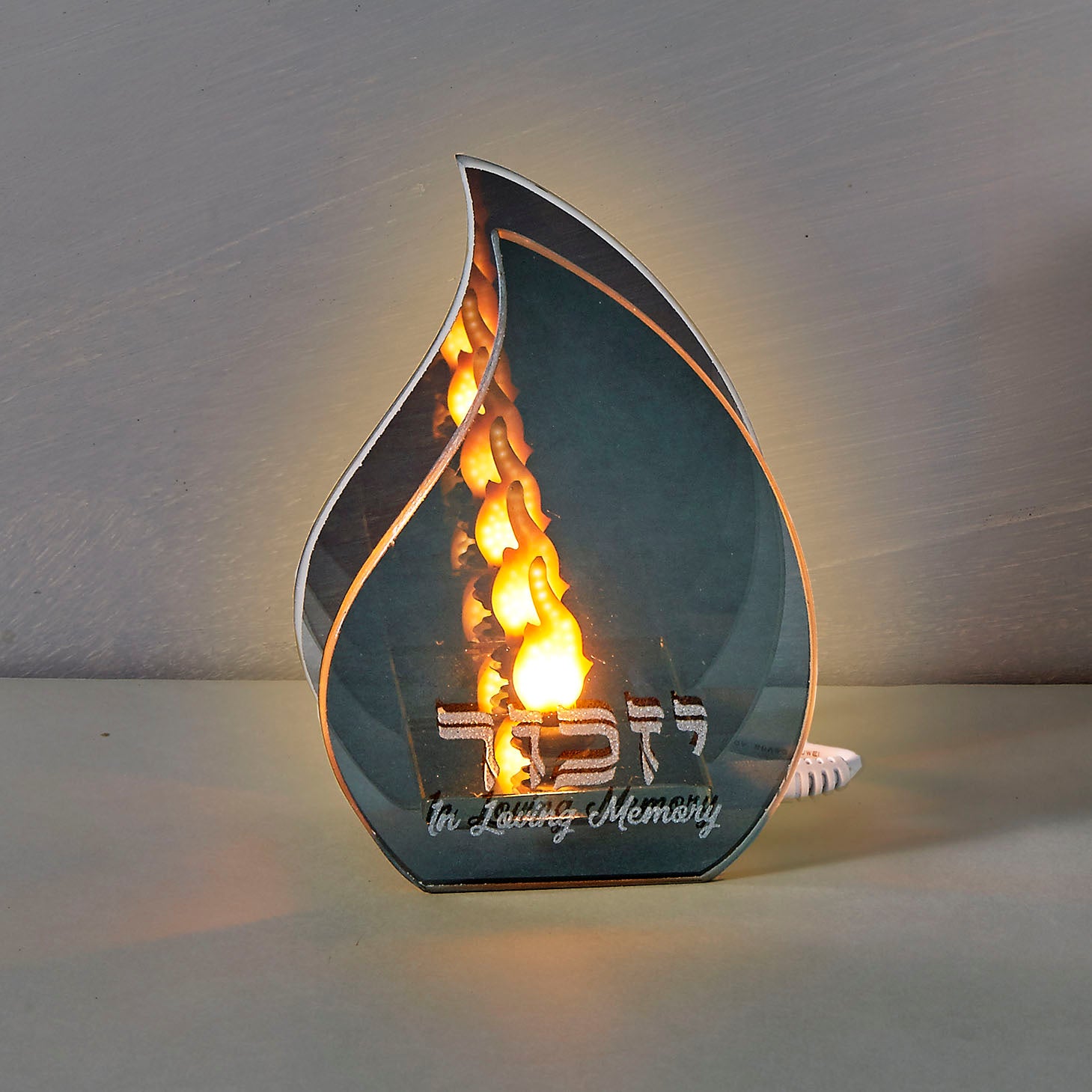 image of electric candle that is in the shape of a flame