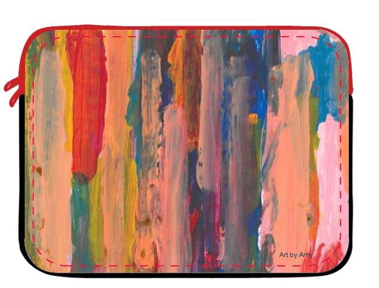 Neoprene Laptop case designed with Layers of vertical brushstrokes overlapping. In the center the background is a dark blue, to the left is yellow, and the right is pink. The top layer of brushstrokes are mostly a pale pink