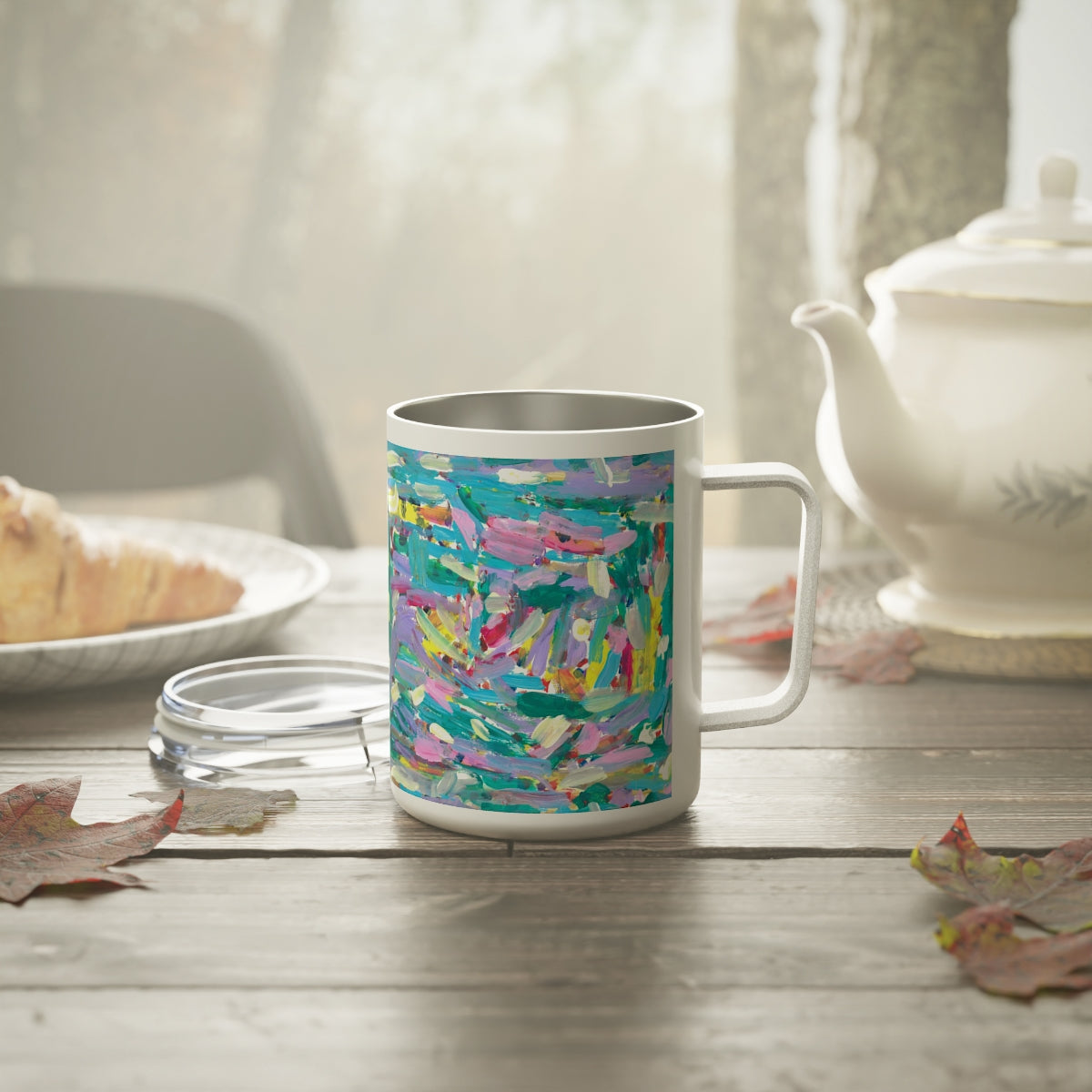 insulated mug with abstract artwork on them