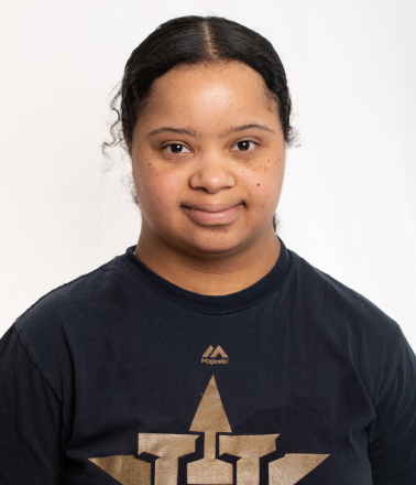 Smiling woman wearing a black shirt.