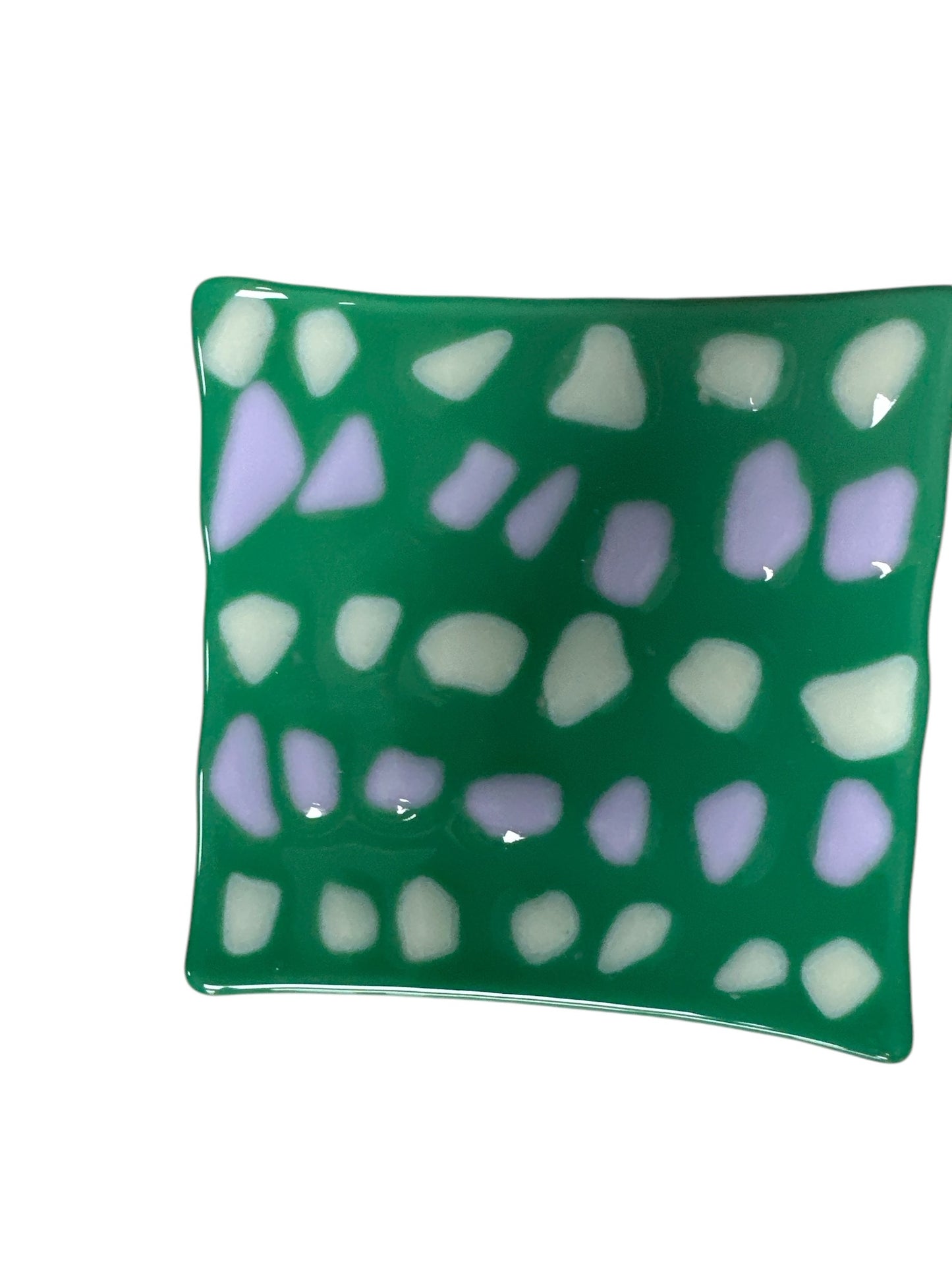 Colorful green glass wavy plate with colorful dots.
