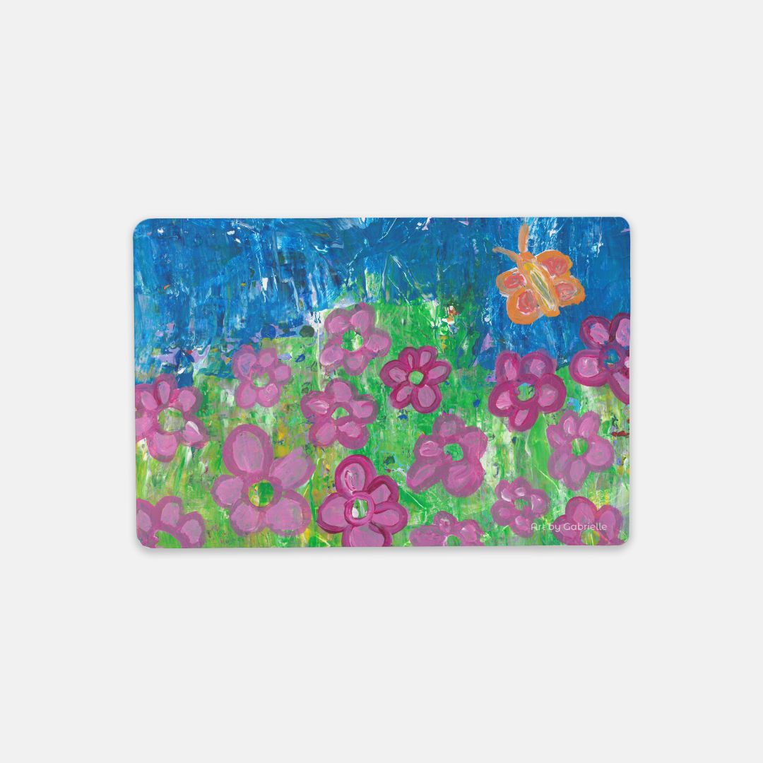 desk mat of butterfly amongst a field of flowers
