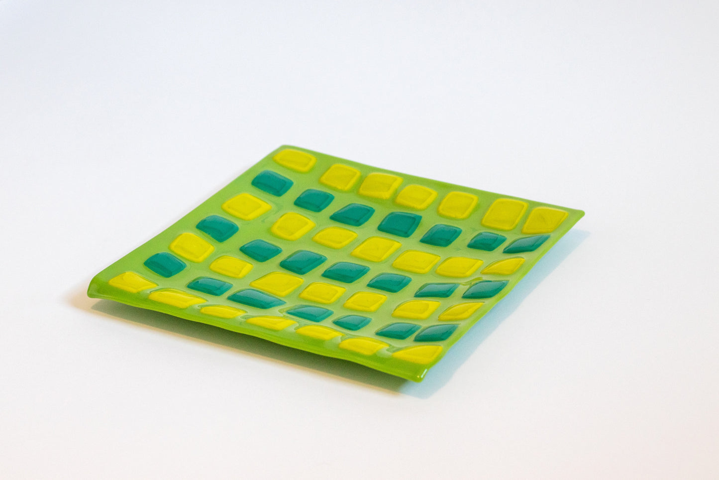 various shades of green glass plate