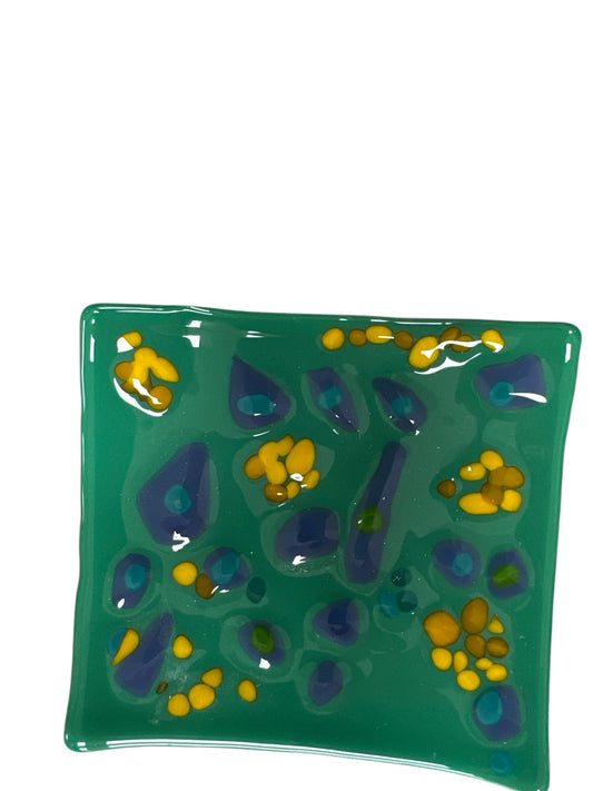 Colorful green glass wavy tray with yellow and dark blue dots