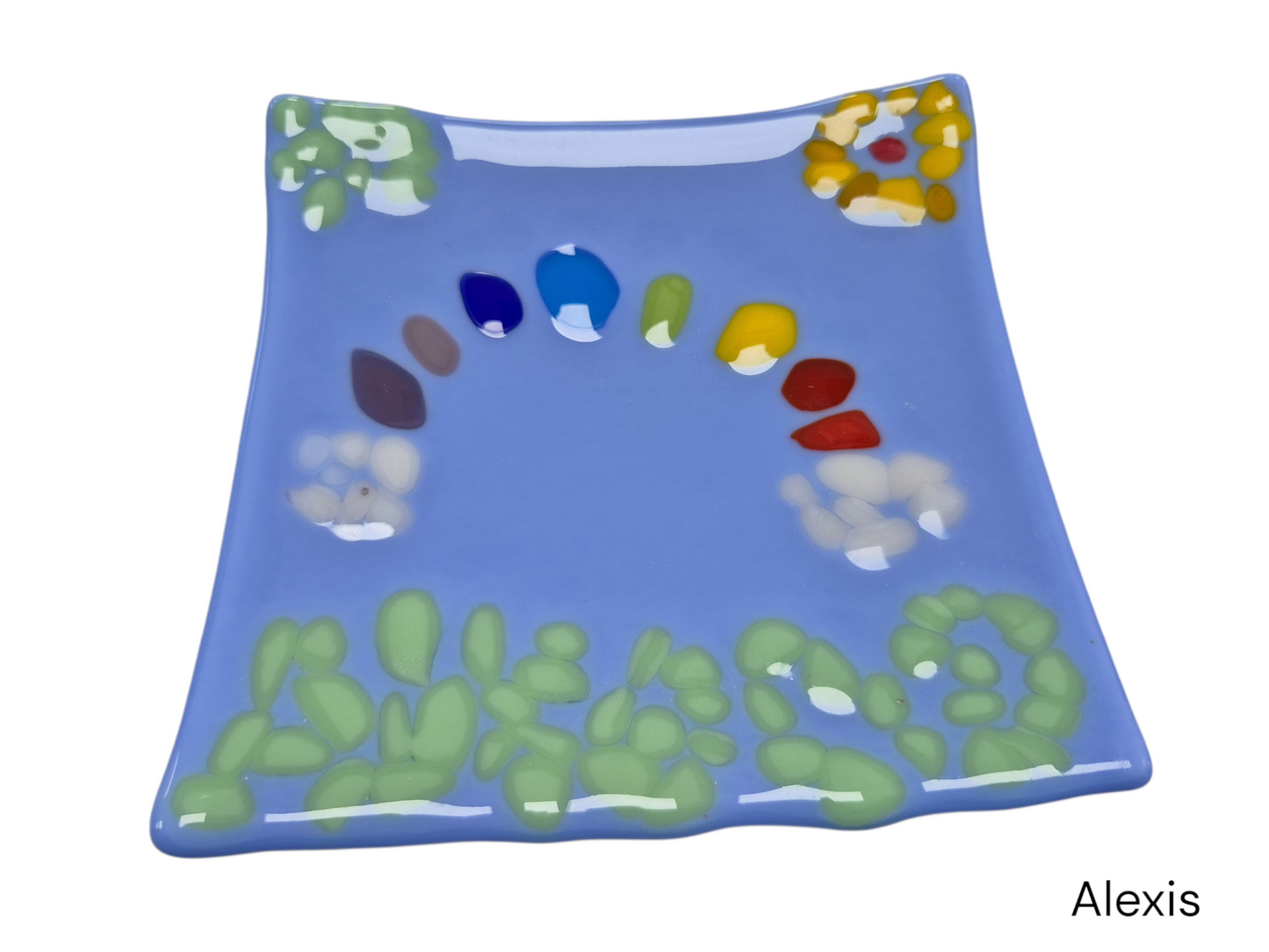 Colorful light blue wavy glass with colorful dots in a shape of rainbow and flowers.