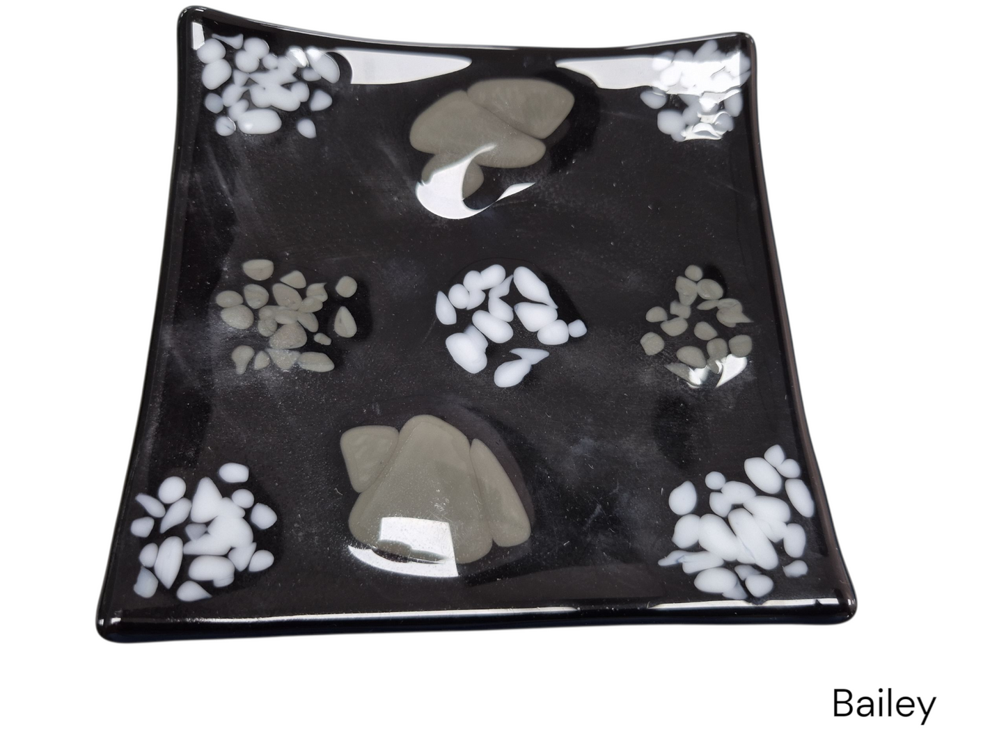 Colorful black wavy glass with white and gray color dots. 