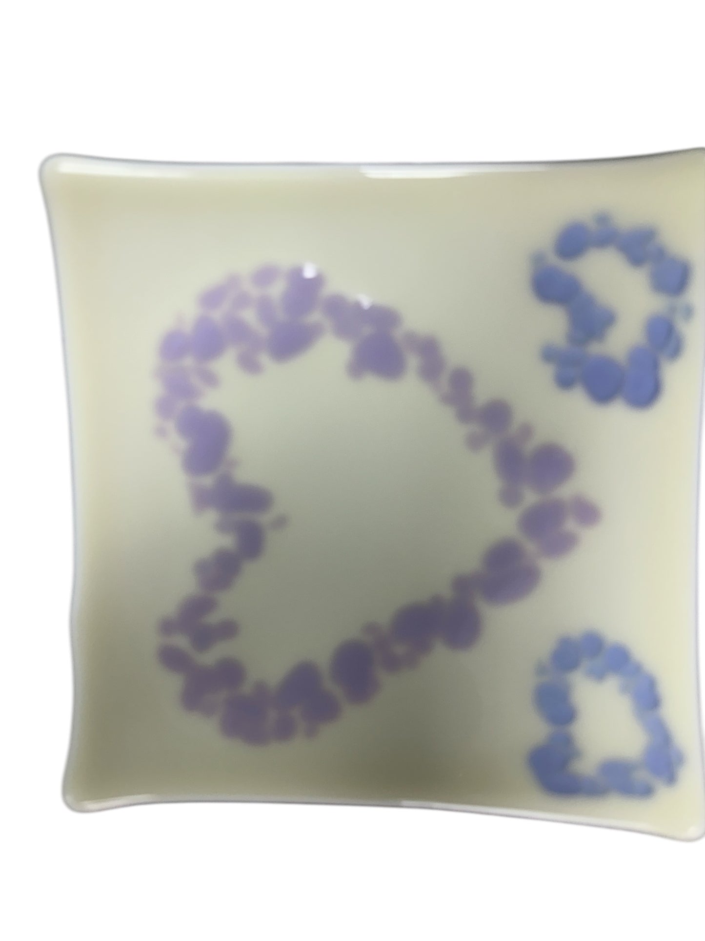 White glass tray with purple and light blue hearts.