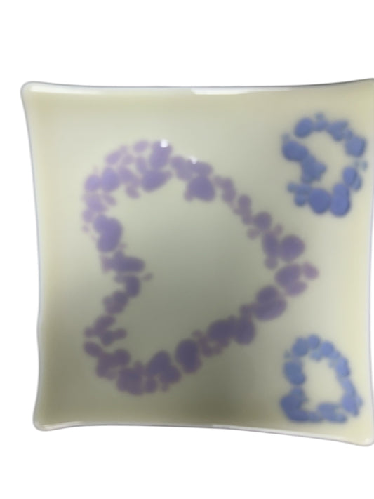 White glass tray with purple and light blue hearts.