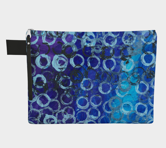 Zippered carryall bag depicting gradient blue background with white and black circles overlaid
