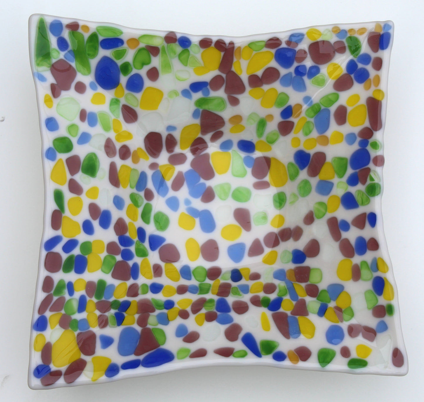 off white glass square bowl with specs of yellow, purple, green, and blue
