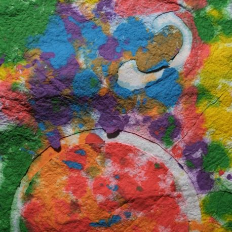 Pigment on recycled paper artwork with colors of green, blue, purple, red and orange melting together beneath a white circle moon