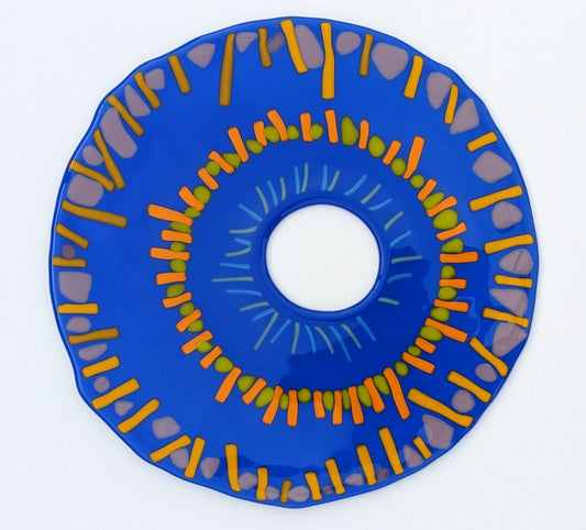 round abstract glass art with circular patterns