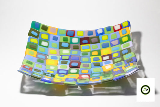 glass piece of multicolor squares ontop of squares