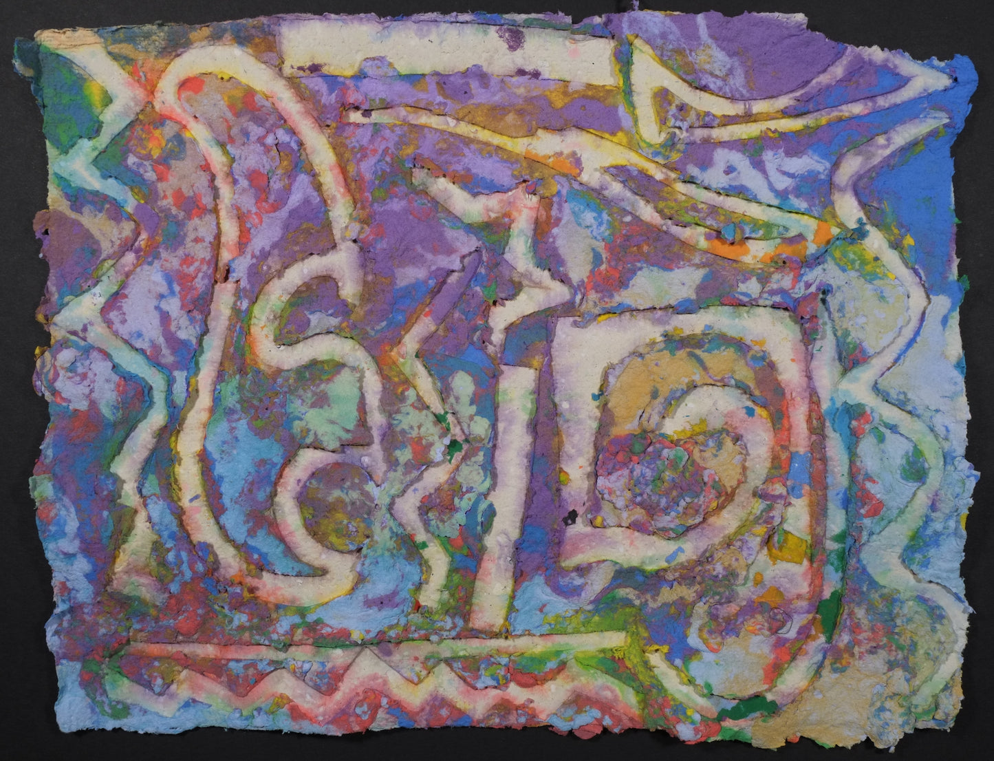 Highly textured handmade paper with purple, blue, light blue, and red surrounding white embossed curved shapes that are all over the page