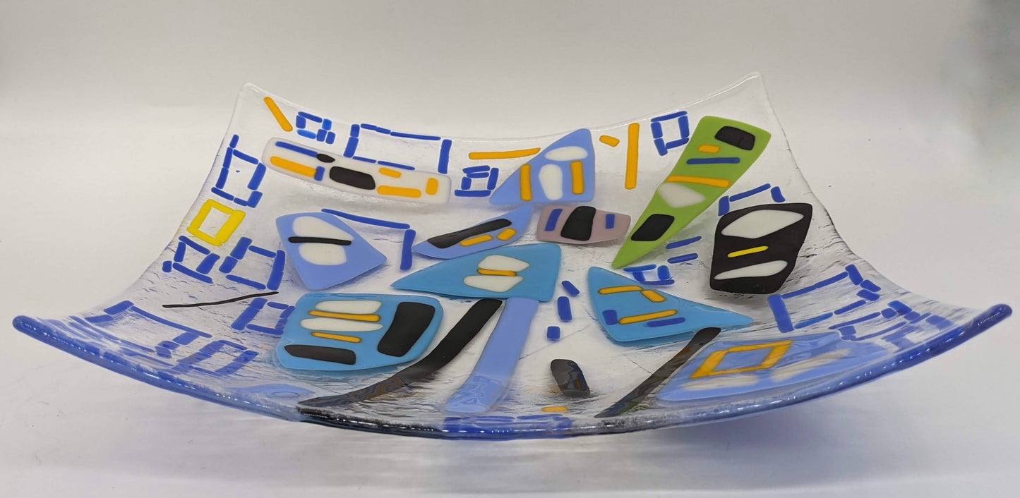 clear glass plate with blue squares with white and yellow spots