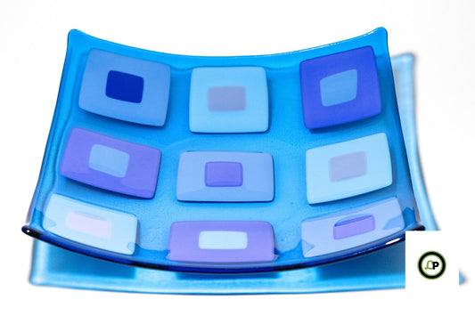 blue glass bowl with squares ontop