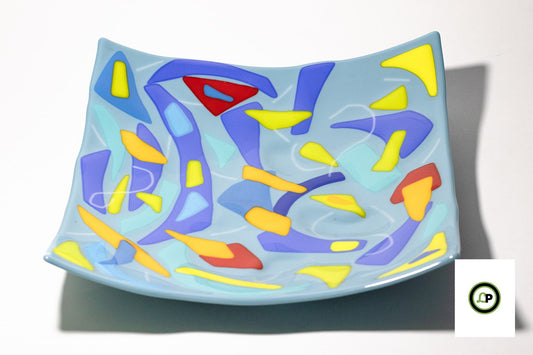 blue glass plate with lines and curves on it