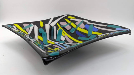 black glass square bowl with lines of greens, white, and blues overlapped