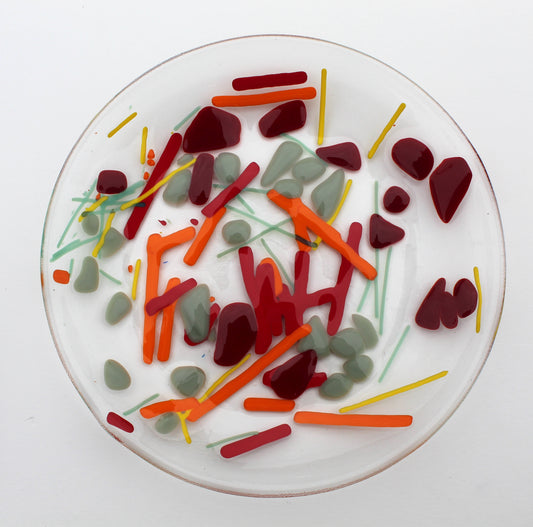Clear Glass Bowl with lines of yellow, orange, and green & splotches of gray and dark red scattered