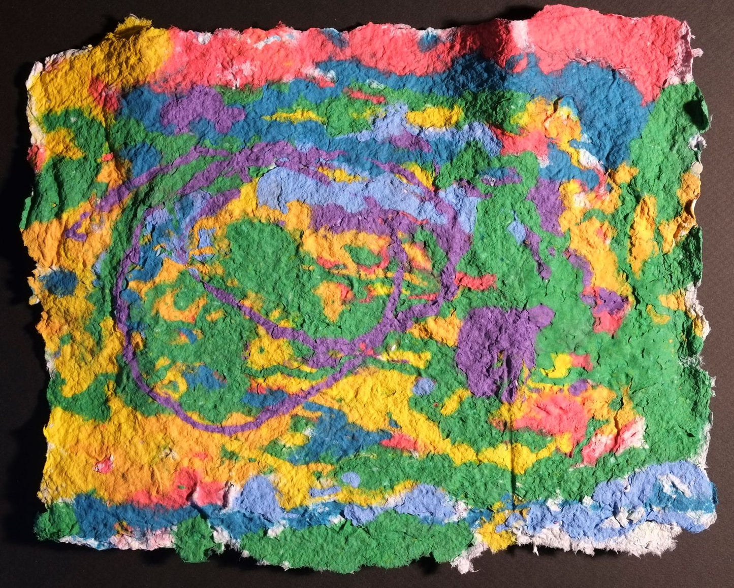Pigment on recycled paper artwork with melting colors of red, blue, green and yellow beneath swirling purple accents