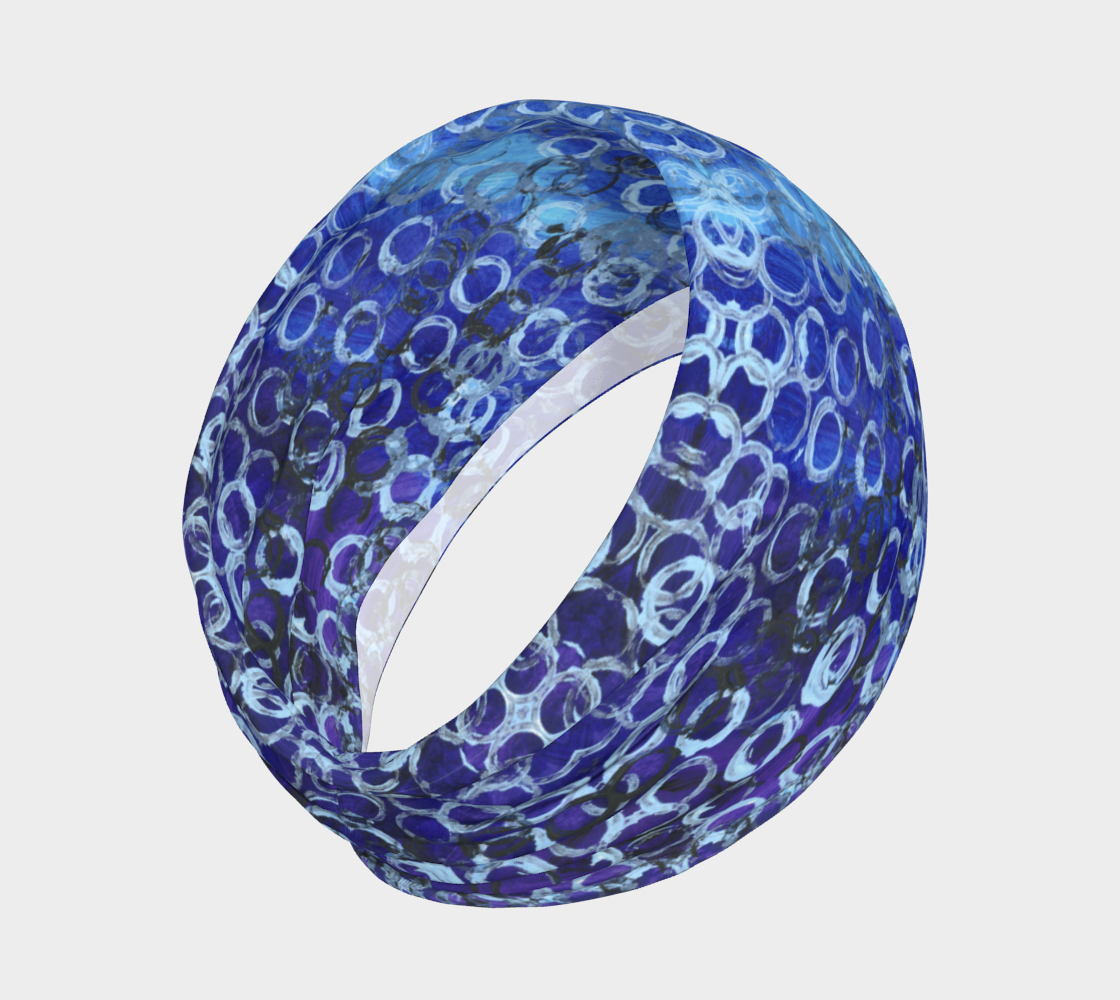 a wide headband of different shades of blue with rings of light and dark blue