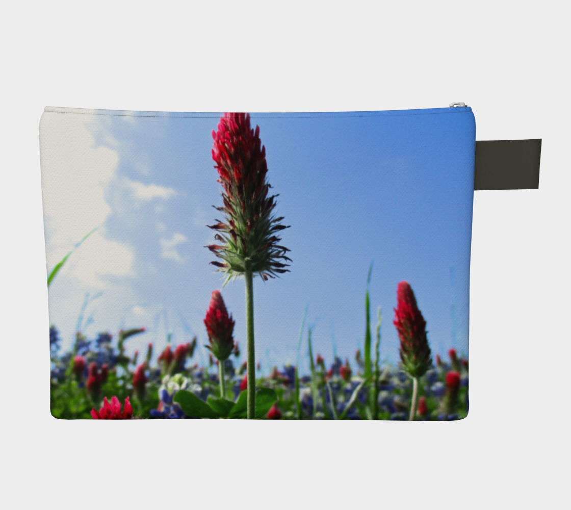 Zippered carryall bag with red Indian paintbrush flowers and bluebonnets in a green field
